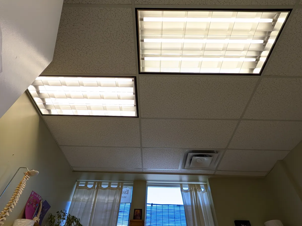 Two LED troffer panels lit in a drop ceiling